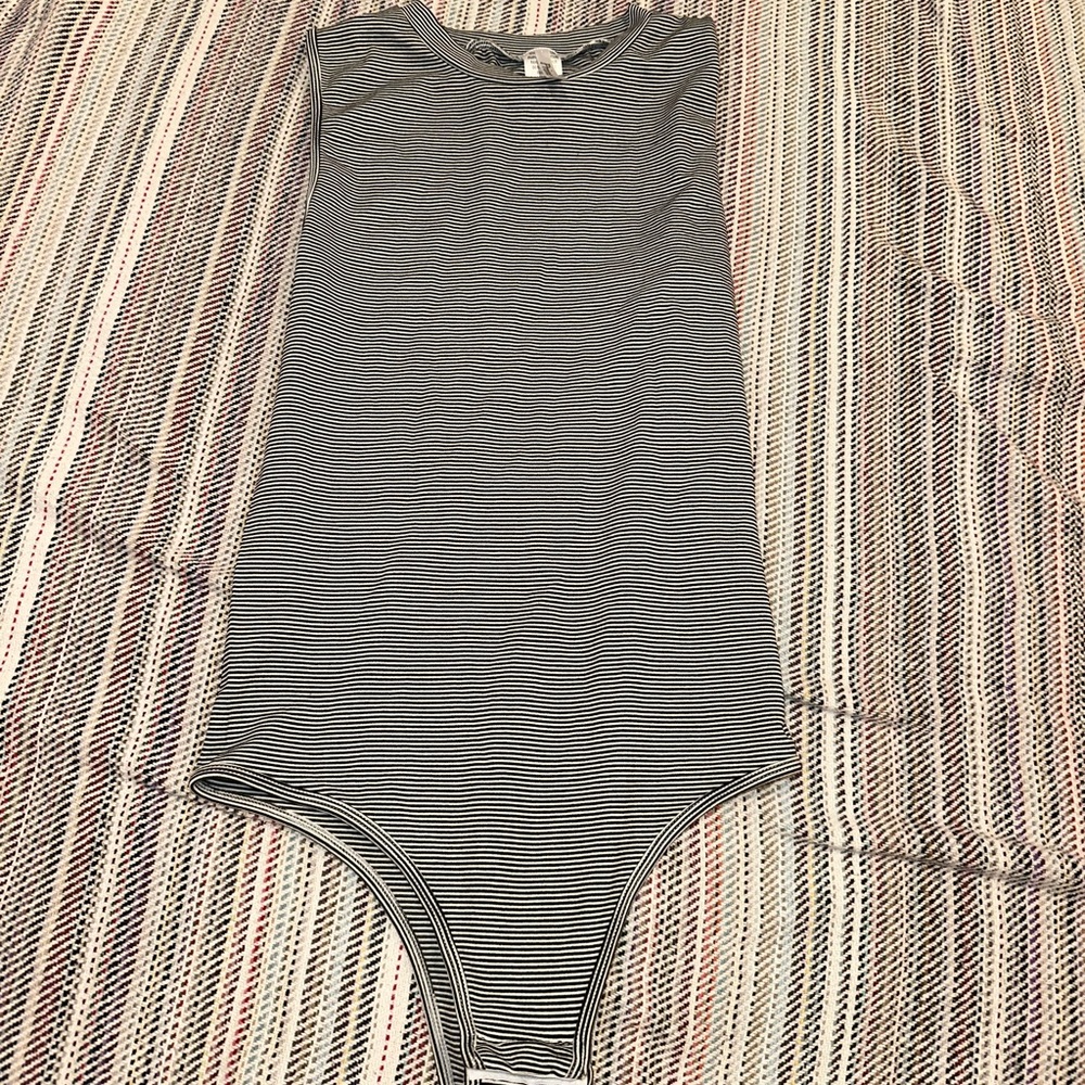 prime cut, stretchy bodysuit, striped black and white, one size.
